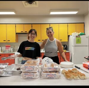 Two women serving food